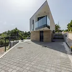 Beachfront Luxury Mare, Featuring A Heated Pool, Fitness Area, And Sauna Villa