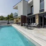 Beachfront Luxury Mare, Featuring A Heated Pool, Fitness Area, And Sauna Villa