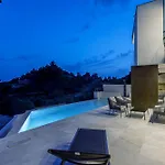 Beachfront Luxury Mare, Featuring A Heated Pool, Fitness Area, And Sauna Villa