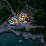 Beachfront Luxury Mare, Featuring A Heated Pool, Fitness Area, And Sauna