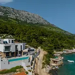 Villa Beachfront Luxury Mare, Featuring A Heated Pool, Fitness Area, And Sauna