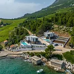 Beachfront Luxury Mare, Featuring A Heated Pool, Fitness Area, And Sauna
