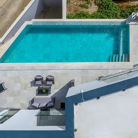 Beachfront Luxury Mare, Featuring A Heated Pool, Fitness Area, And Sauna