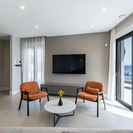 Beachfront Luxury Mare, Featuring A Heated Pool, Fitness Area, And Sauna