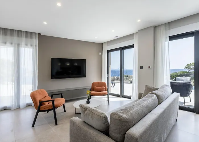 Beachfront Luxury Mare, Featuring A Heated Pool, Fitness Area, And Sauna