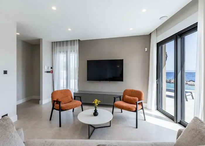 Beachfront Luxury Mare, Featuring A Heated Pool, Fitness Area, And Sauna